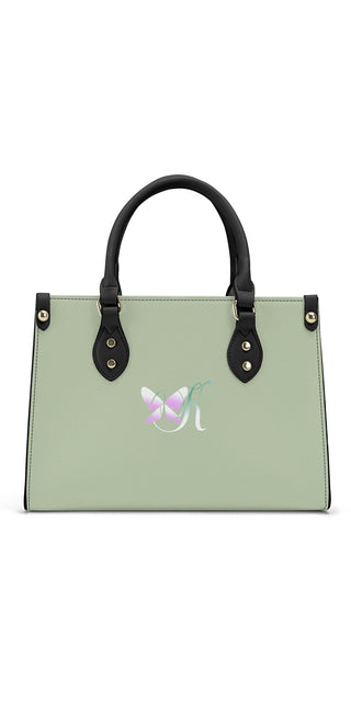 Elegant Women's PU Leather Handbag with Floral Emblem

This image shows a stylish tote bag in a light green color with a floral emblem embellishment. The bag features dual handles and a polished black trim, giving it a sleek and sophisticated design. The placement of the product in the center of the frame allows the bag's features to be clearly showcased.