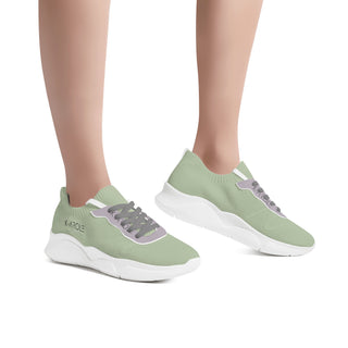 Stylish and comfortable breathable mesh sneakers from K-AROLE's women's collection, featuring a chunky, trendy design in a light green hue.