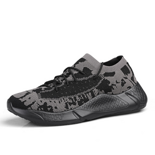 Stylish monochrome jogging sneakers with a perforated mesh upper and bold graphic design. The sneakers feature a comfortable and flexible sole, making them suitable for active outdoor wear.