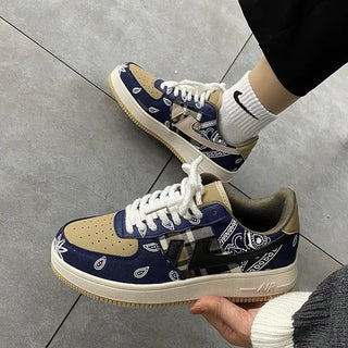 Navy and tan casual sneakers with printed pattern detail