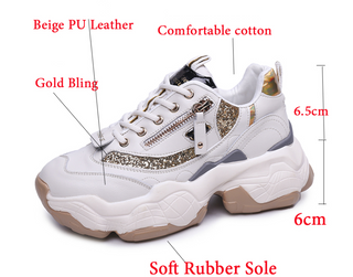Beige PU leather women's sneakers with gold bling detail, comfortable cotton interior, and soft rubber sole. The sneakers are displayed on a plain background, showcasing their trendy and stylish design.