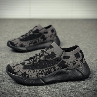 Stylish monochrome jogging sneakers featuring a modern camouflage pattern and sleek design for active wear.