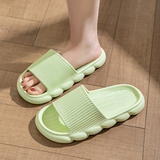 Wave bottom slippers in mint green, showcasing a casual and comfortable design for women's home footwear. The non-slip bathroom slippers feature a ribbed texture for added grip on various surfaces.