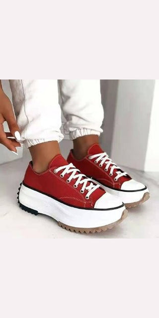 Stylish red canvas sneakers with chunky white platform soles on display