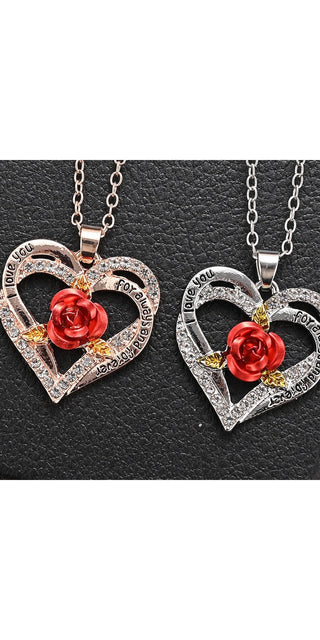 Women's Fashion Rose Heart Necklace: Two delicate silver-tone hearts with a striking red rose accent, set against a dark leather-like background, showcasing a chic and romantic jewelry piece.