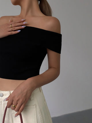 Black off-shoulder knit crop top on female model