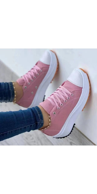 Stylish pink canvas sneakers with white soles, displayed in a modern, minimalist setting