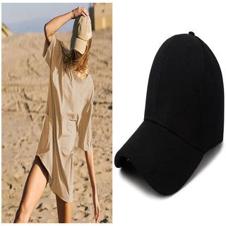 Elegant women's casual summer jumpsuit with pockets and a stylish black baseball cap