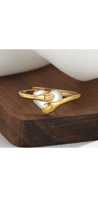 Heart-Shaped Metallic Ring on Wooden Surface