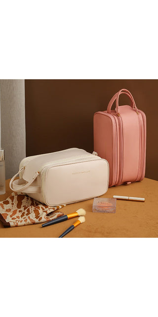 Stylish pink cosmetic bag with multi-compartment design, perfect for organizing and carrying beauty essentials on the go.