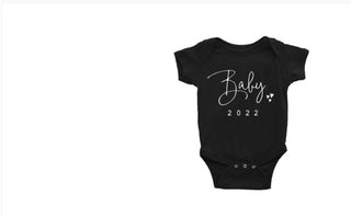 Stylish black baby onesie with "Baby 2022" text in white cursive font against a plain white background.