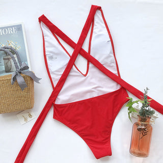 Back View of Halter Neck Deep V Tied One-Piece Swimsuit - Bold Red Color - Placed on a Table