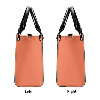 Elegant and stylish satchel handbag from K-AROLE™️. Chic peach-colored leather body with sleek black trim and hardware. Versatile and functional design for everyday use.