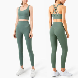 Stylish women's athletic wear: Vibrant fitness leggings and matching sports bra in a trendy sage green color, featuring a comfortable, high-waisted design and sleek, cross-back straps for a modern, performance-ready look.