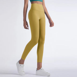 Vibrant women's fitness leggings in a bold yellow hue, designed for an active lifestyle, showcased against a plain background.