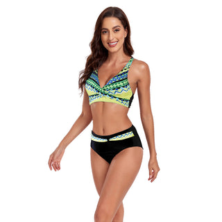 Vibrant patterned bikini with halter top and high-waisted bottoms, showcasing a stylish and confident beach look.