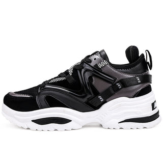 Stylish and sporty women's fashion sneakers from Hypersku. The black and white platform shoes feature a sleek, futuristic design with textured materials and eye-catching straps. These trendy, comfortable athletic shoes are perfect for both casual wear and outdoor activities.