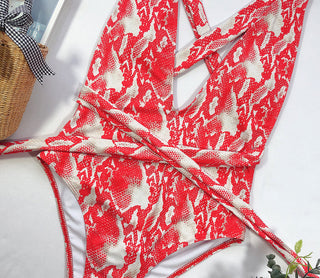 Front View of Vintage-Inspired One-Piece Swimsuit - Stylish Red and White Pattern on Display
