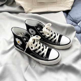 Trendy women's high-top canvas sneakers with daisy flower design, featured in a clean, minimalist product shot.