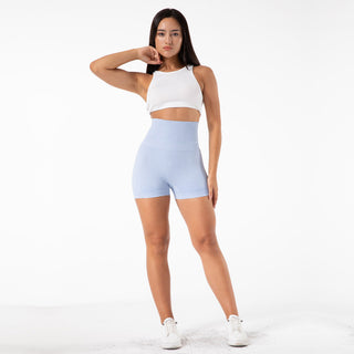 Comfortable high-waist seamless yoga shorts in light blue color worn by a young female model against a plain white background.