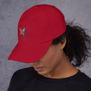 Stylish red K-AROLE branded dad hat with embroidered logo, worn by a person with curly dark hair against a neutral grey background.