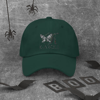 Dark green K-AROLE brand dad hat with embroidered logo, against a grey textured background with black spider decorations.