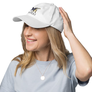 Stylish white dad hat with colorful logo on the front, worn by a smiling young woman with long blonde hair, against a white background.