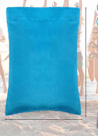 Turquoise beach bag with soft, plush fabric on a sunny day