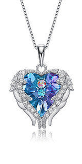 Dazzling Crystal Heart Pendant: Elegant winged necklace showcasing a vibrant crystal heart adorned with sparkling accents, a fashionable accessory for the stylish K-AROLE woman.
