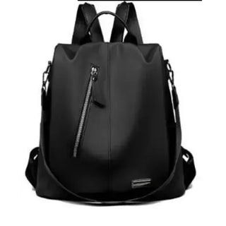 Stylish black backpack with multiple zippers and compartments for women's versatile use.