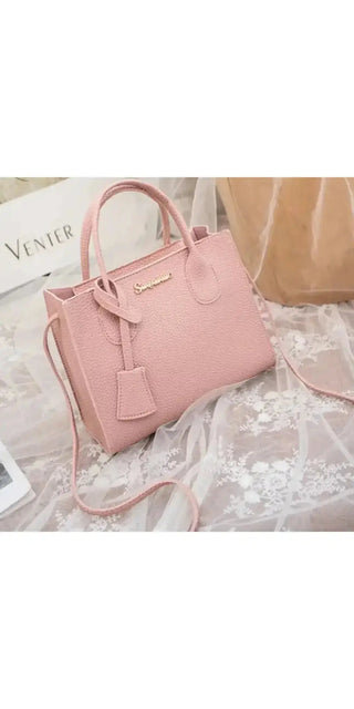 Stylish pink leather handbag with a one-shoulder design and strap, featuring a sleek and modern appearance, suitable for carrying a mobile phone and other essentials.