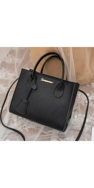 Stylish black leather shoulder bag with modern design and sleek silhouette, perfect for carrying daily essentials and elevating your fashion look.