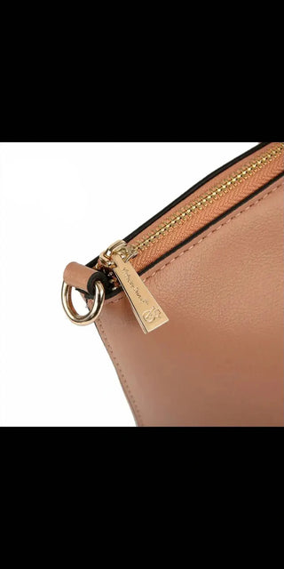 Elegant beige leather shoulder bag with gold-tone hardware and zipper detailing by K-AROLE fashion brand.