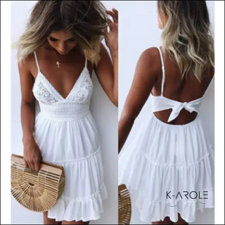 Elegant white lace and chiffon dress with bow detail. Ideal for summer events or casual outings. Offered by K-AROLE, a women's fashion brand featuring trendy and comfortable apparel and accessories.