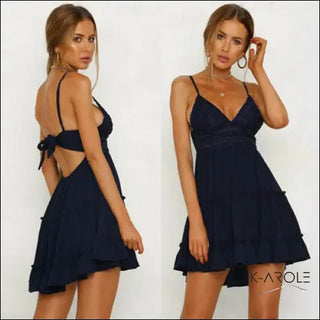 Elegant navy blue mini dress with bow details, modeled on a woman against a white background.