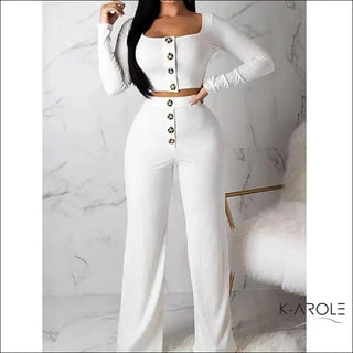 Stylish women's knit set with long sleeves and straight-leg pants, showcased on a white marble background against the K-AROLE brand logo.